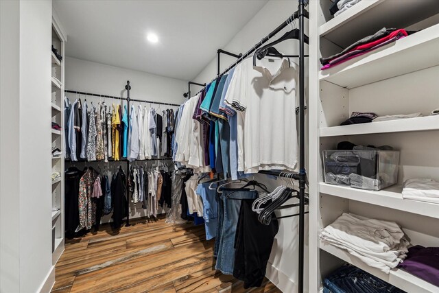 walk in closet featuring wood finished floors