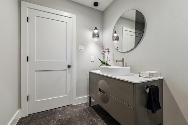 bathroom with baseboards and vanity