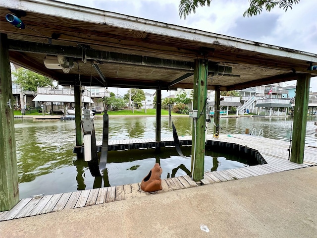 12828 E Madrid, Galveston, TX 77554 - view of dock featuring boat lift and a water view