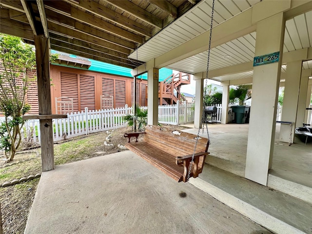 12828 E Madrid, Galveston, TX 77554 - view of patio with fence and stairway