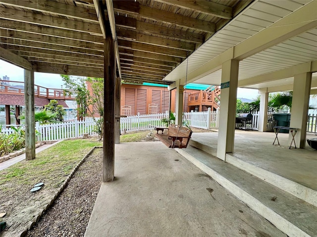 12828 E Madrid, Galveston, TX 77554 - view of patio featuring fence