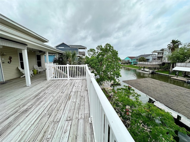 12828 E Madrid, Galveston, TX 77554 - wooden terrace featuring a water view