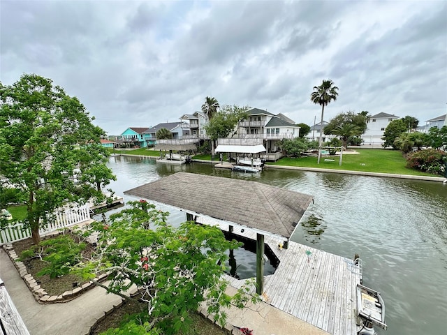 12828 E Madrid, Galveston, TX 77554 - view of dock with a water view, fence, and a residential view