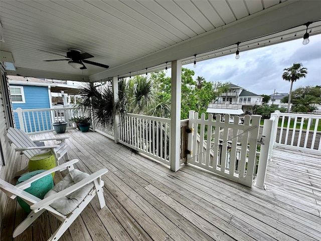 12828 E Madrid, Galveston, TX 77554 - wooden terrace featuring ceiling fan