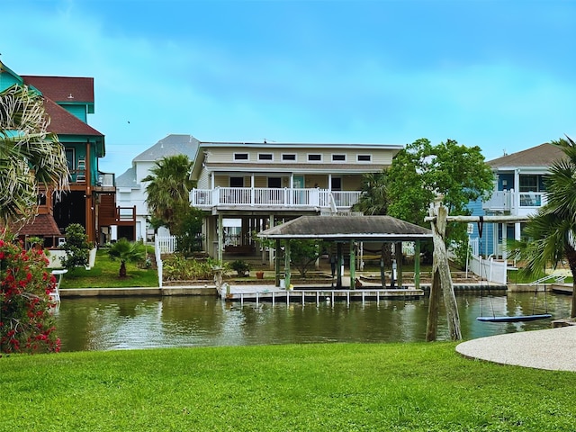 12828 E Madrid, Galveston, TX 77554 - view of dock with a lawn and a water view