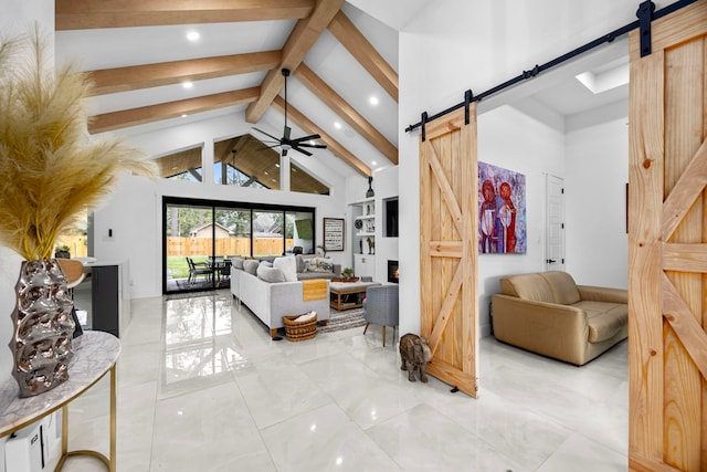 bedroom with access to outside, beamed ceiling, a barn door, and high vaulted ceiling