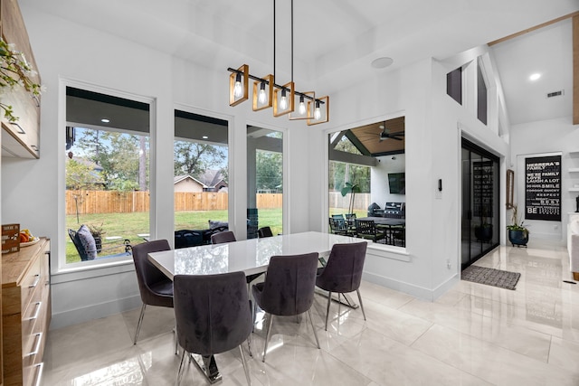 dining space with ceiling fan, visible vents, and plenty of natural light