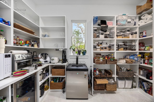 pantry featuring wine cooler