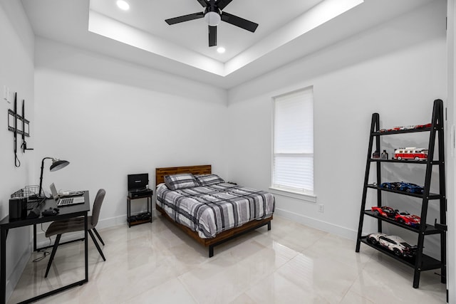 bedroom with baseboards, recessed lighting, and a raised ceiling