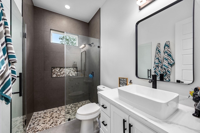 full bathroom with recessed lighting, vanity, walk in shower, and toilet