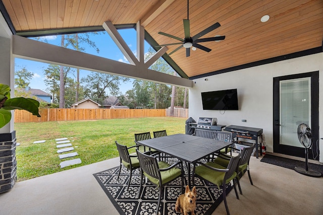 view of patio with a fenced backyard, a ceiling fan, and outdoor dining space