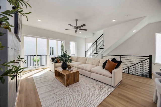 living room with recessed lighting, a ceiling fan, and wood finished floors