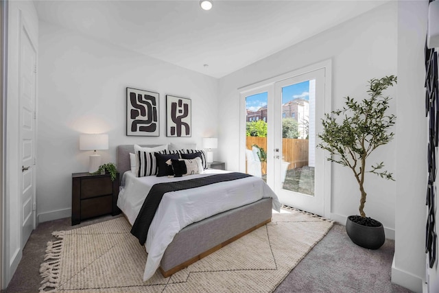carpeted bedroom with baseboards, french doors, and access to exterior