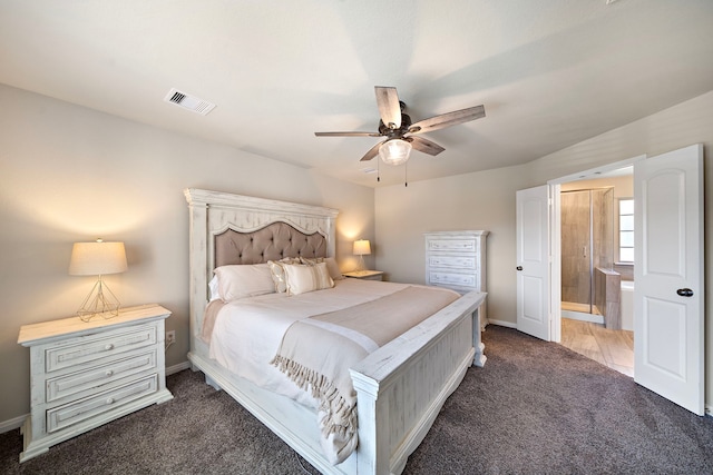 bedroom featuring carpet floors, ensuite bath, baseboards, and ceiling fan