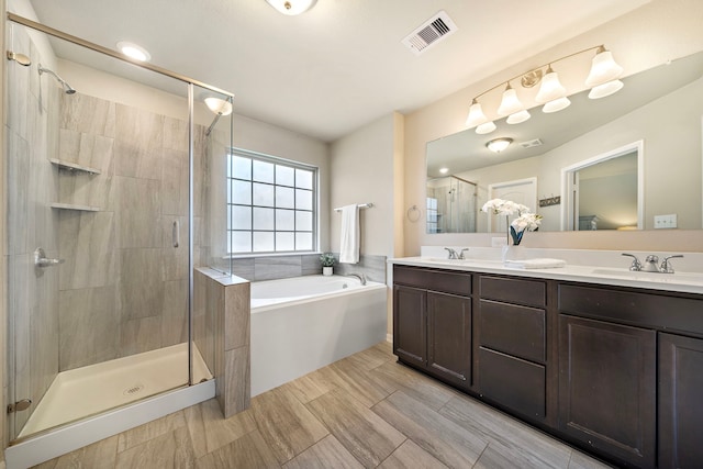1074 Pleasant Bnd, Conroe, TX 77301 - bathroom featuring a bath, a stall shower, and double vanity