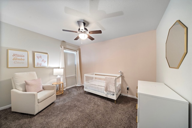 1074 Pleasant Bnd, Conroe, TX 77301 - carpeted bedroom with a crib, baseboards, and a ceiling fan