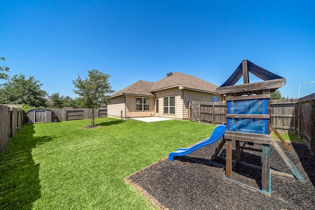 1074 Pleasant Bnd, Conroe, TX 77301 - rear view of property featuring a playground and a patio area