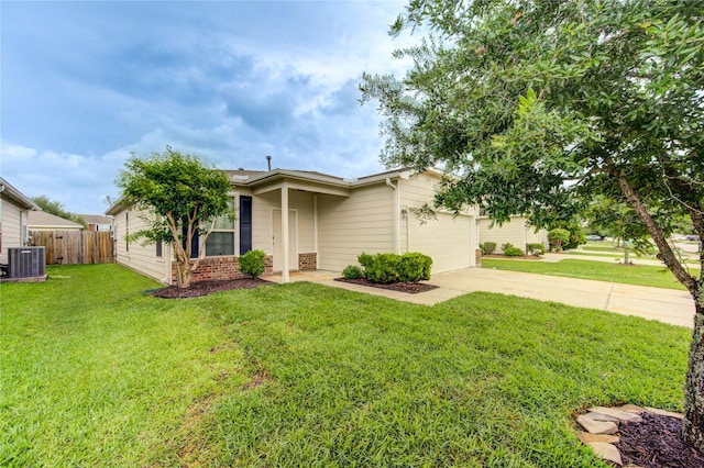 view of front facade featuring fence, a garage, a front yard, central AC unit, and concrete driveway