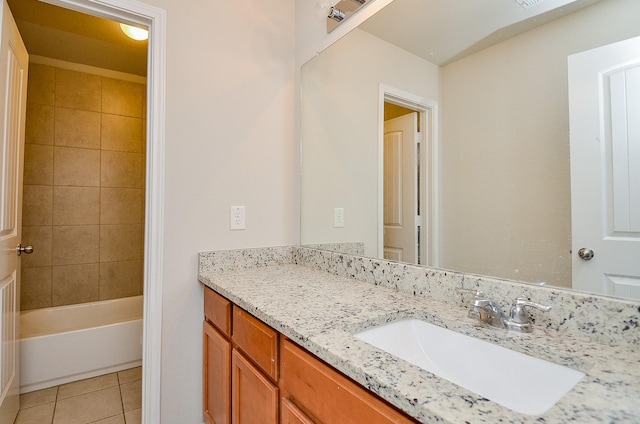 bathroom featuring vanity, bathtub / shower combination, and tile patterned floors