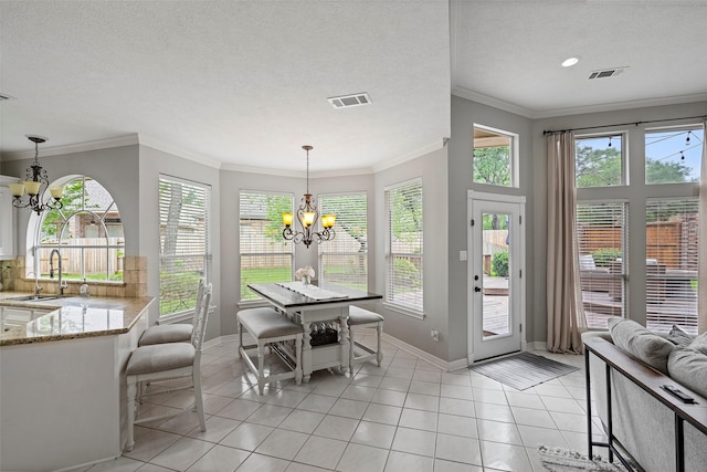 dining space with baseboards, visible vents, light tile patterned flooring, and a chandelier