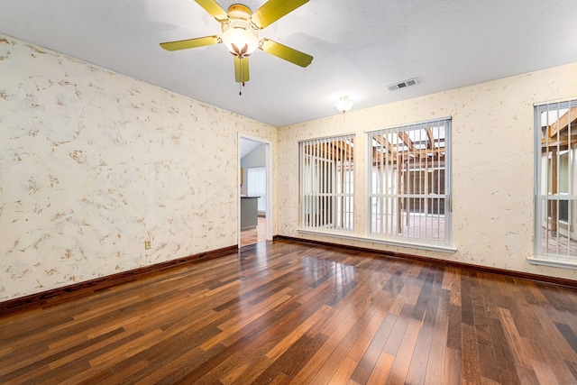 6103 Gallant Forest Dr, Houston, TX 77088 - unfurnished room featuring baseboards, visible vents, a wealth of natural light, and hardwood / wood-style floors
