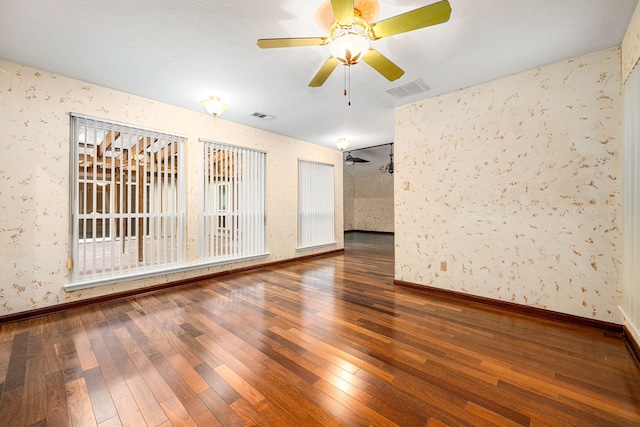 6103 Gallant Forest Dr, Houston, TX 77088 - unfurnished room featuring ceiling fan, wood-type flooring, wallpapered walls, and visible vents