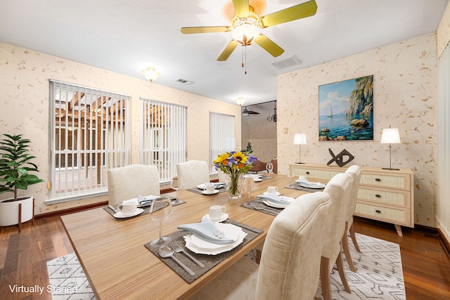 6103 Gallant Forest Dr, Houston, TX 77088 - dining room with wallpapered walls, wood finished floors, and visible vents