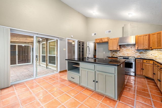 6103 Gallant Forest Dr, Houston, TX 77088 - kitchen featuring decorative backsplash, visible vents, range hood, a sink, and stainless steel gas range