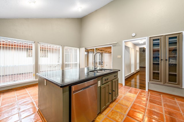 6103 Gallant Forest Dr, Houston, TX 77088 - kitchen featuring dark countertops, a center island with sink, dishwasher, a sink, and light tile patterned floors