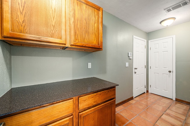 6103 Gallant Forest Dr, Houston, TX 77088 - interior space with visible vents, brown cabinetry, and baseboards