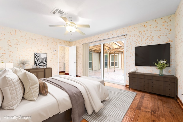 6103 Gallant Forest Dr, Houston, TX 77088 - bedroom with access to outside, wood-type flooring, and wallpapered walls