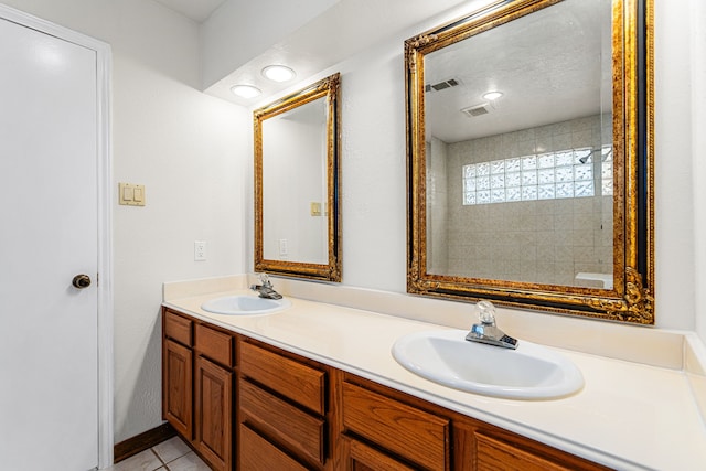 6103 Gallant Forest Dr, Houston, TX 77088 - full bath with a sink, tile patterned floors, double vanity, and visible vents