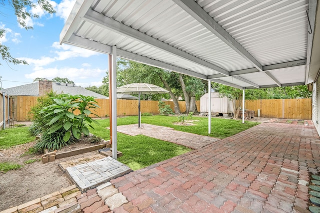 6103 Gallant Forest Dr, Houston, TX 77088 - view of patio with a fenced backyard, a storage unit, and an outdoor structure