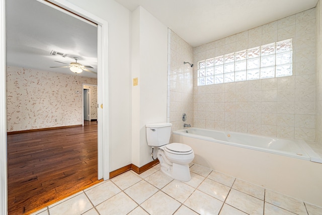 6103 Gallant Forest Dr, Houston, TX 77088 - full bathroom with ceiling fan, shower / bathtub combination, toilet, tile patterned floors, and baseboards