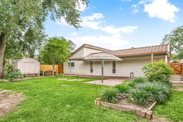 6103 Gallant Forest Dr, Houston, TX 77088 - rear view of property with a tile roof, a patio area, brick siding, a shed, and a yard