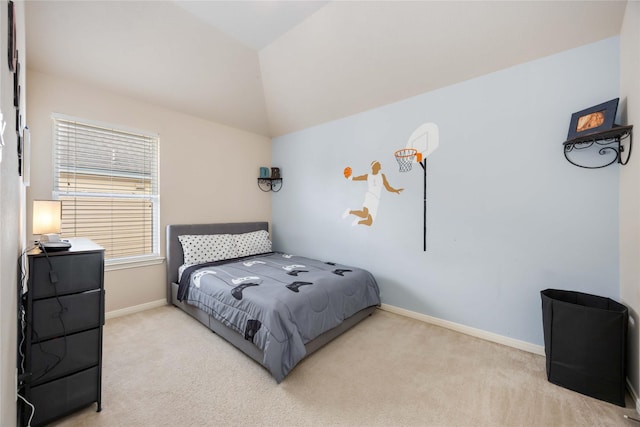 bedroom with carpet flooring, baseboards, and vaulted ceiling