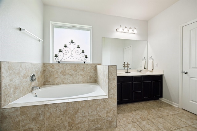 full bathroom with double vanity, tile patterned floors, a sink, and a garden tub