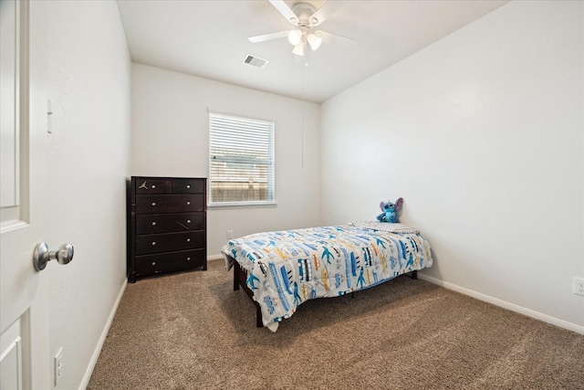 carpeted bedroom featuring baseboards, ceiling fan, and visible vents