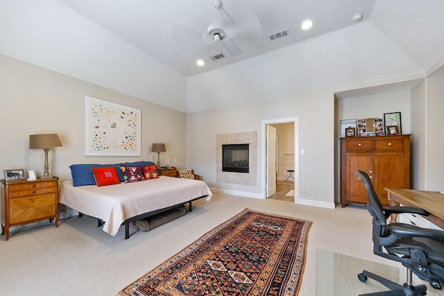bedroom with visible vents, baseboards, vaulted ceiling, and light colored carpet