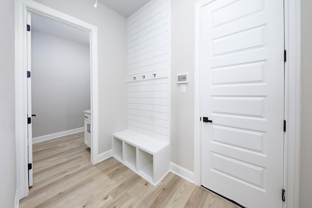 mudroom featuring baseboards and light wood-type flooring
