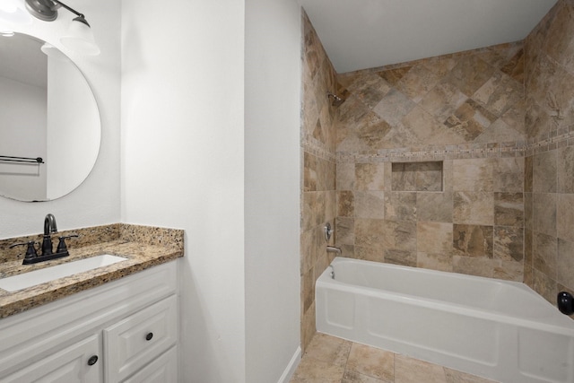 bathroom with baseboards, bathing tub / shower combination, and vanity