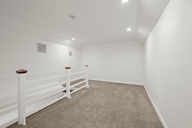 below grade area featuring carpet flooring, recessed lighting, and visible vents
