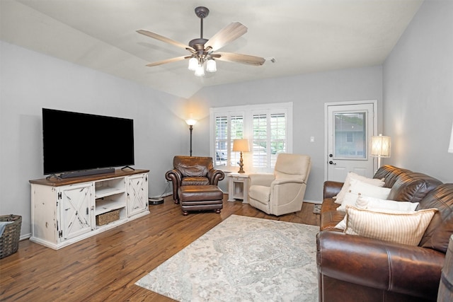 living area with ceiling fan, wood finished floors, and visible vents