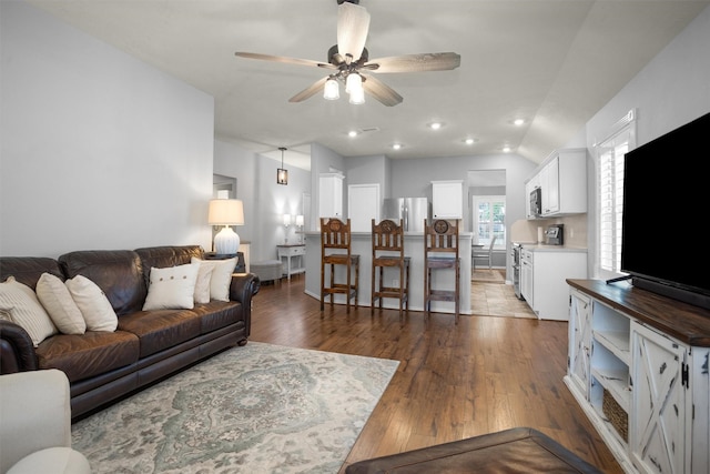 living room featuring recessed lighting, ceiling fan, and hardwood / wood-style floors