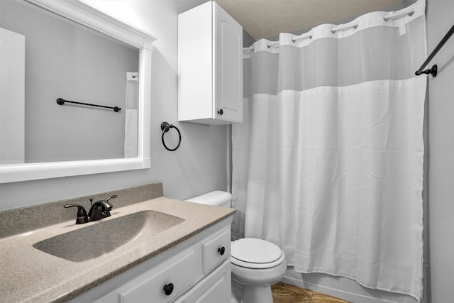 full bath with vanity and toilet