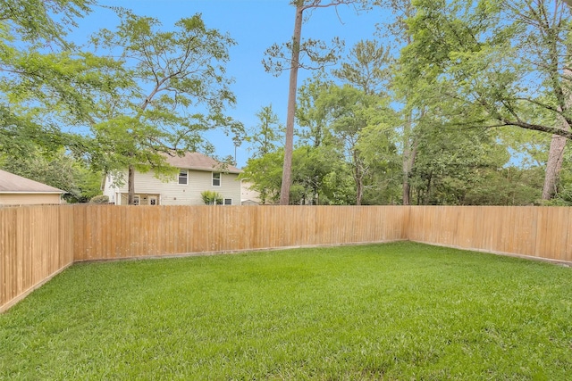 view of yard featuring a fenced backyard