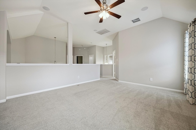 unfurnished room with visible vents, a ceiling fan, and lofted ceiling