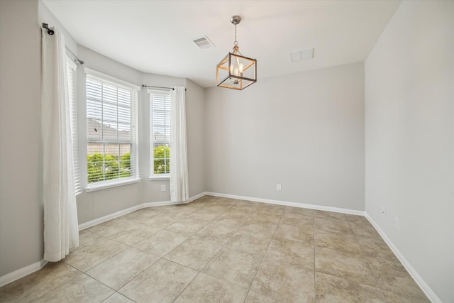 unfurnished room featuring baseboards, an inviting chandelier, light tile patterned floors, and visible vents