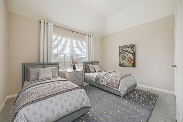 carpeted bedroom featuring baseboards and vaulted ceiling