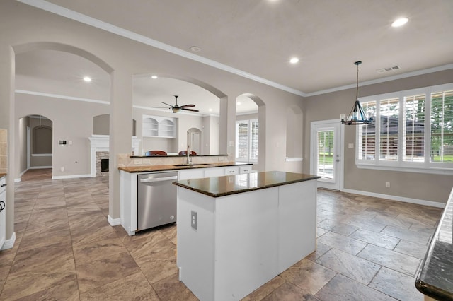 kitchen with a ceiling fan, visible vents, dark countertops, dishwasher, and a sink